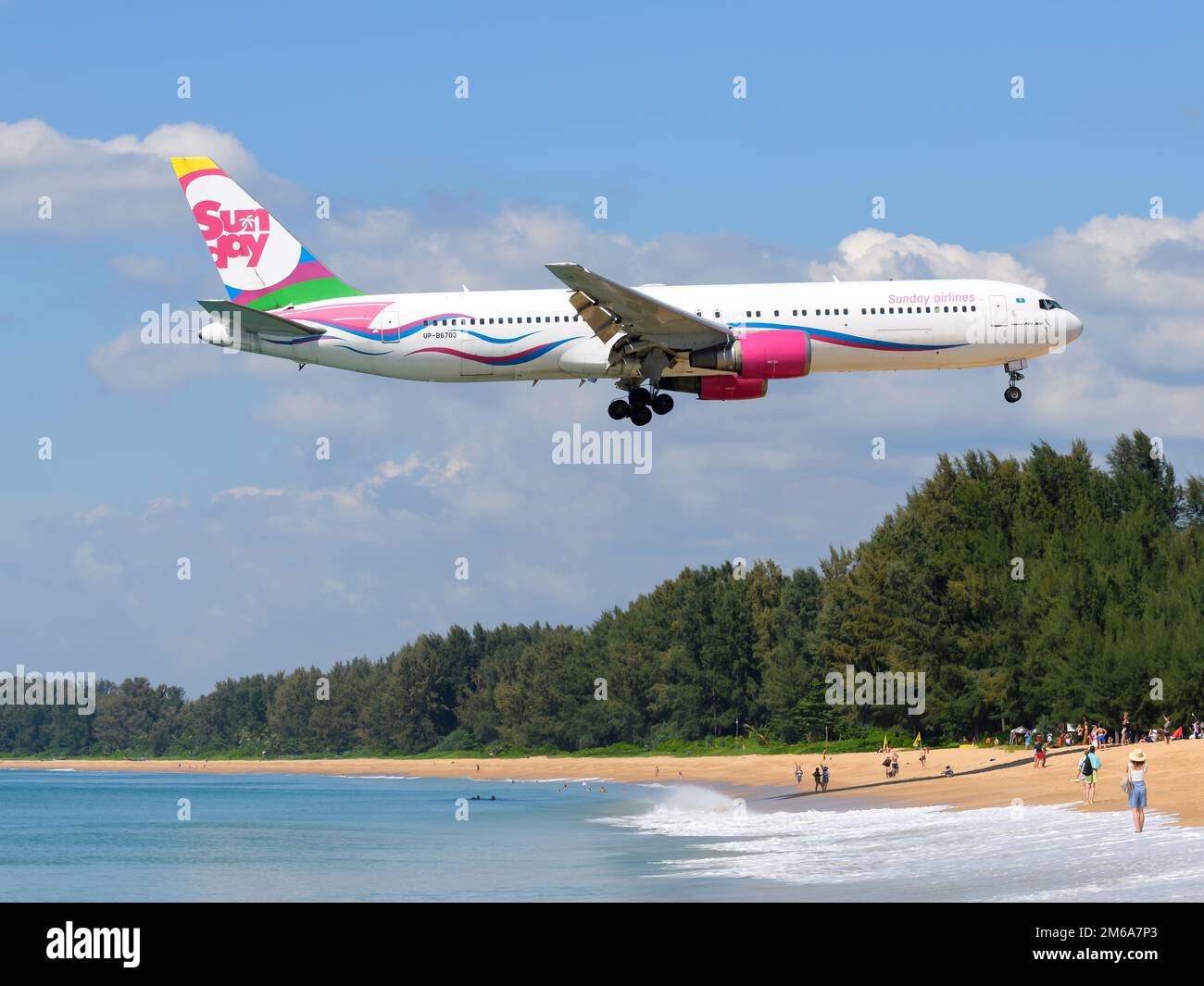 Sunday Airlines Boeing 767 aircraft. Charter airline from Kazakhstan Sunday Airline airplane 767 over Mai Khao Beach near Phuket Airport. Stock Photo