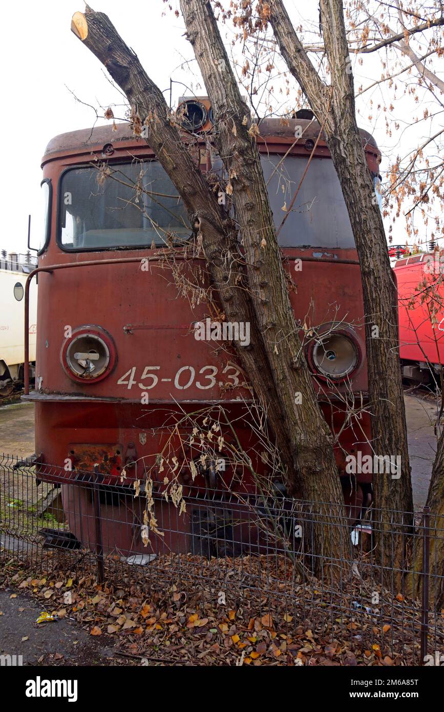Redundant and disused electric locomotives retired from use in a a railway depot in Bucharest, Romania Stock Photo