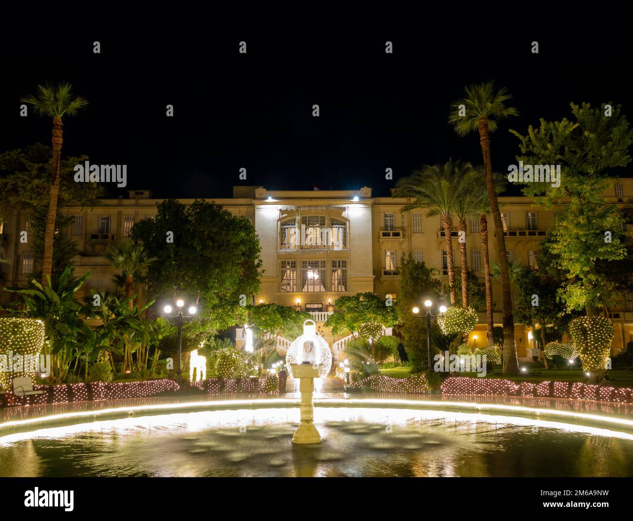 The floodlit garden of the Winter Palace Hotel Luxor Egypt during the Christmas season Stock Photo