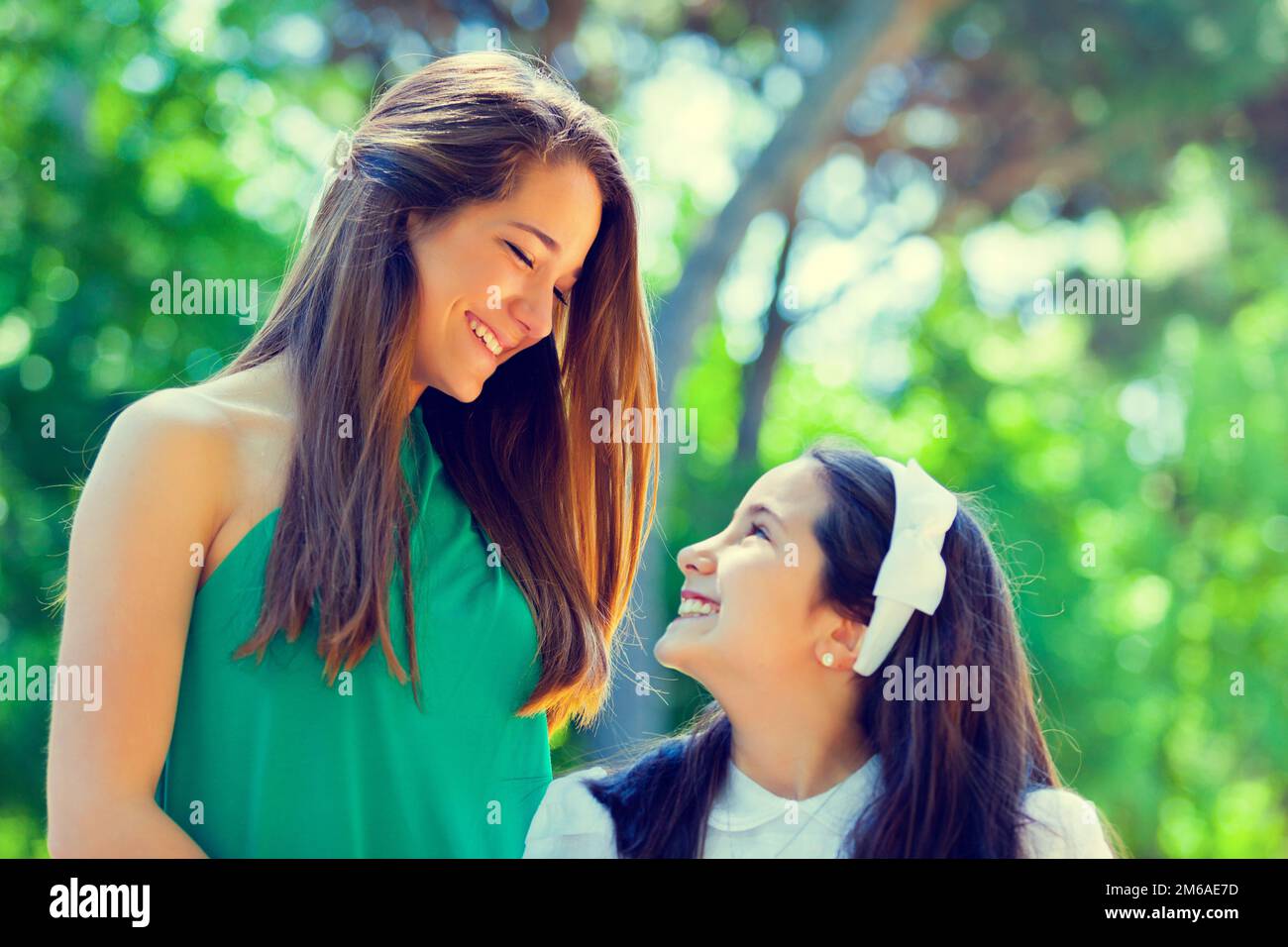 Two sisters in the First Communion Day Stock Photo