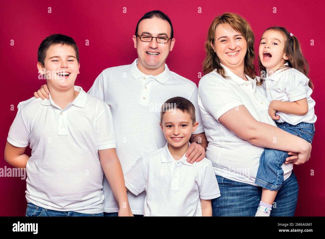 Five Member Family Smiling Stock Photo