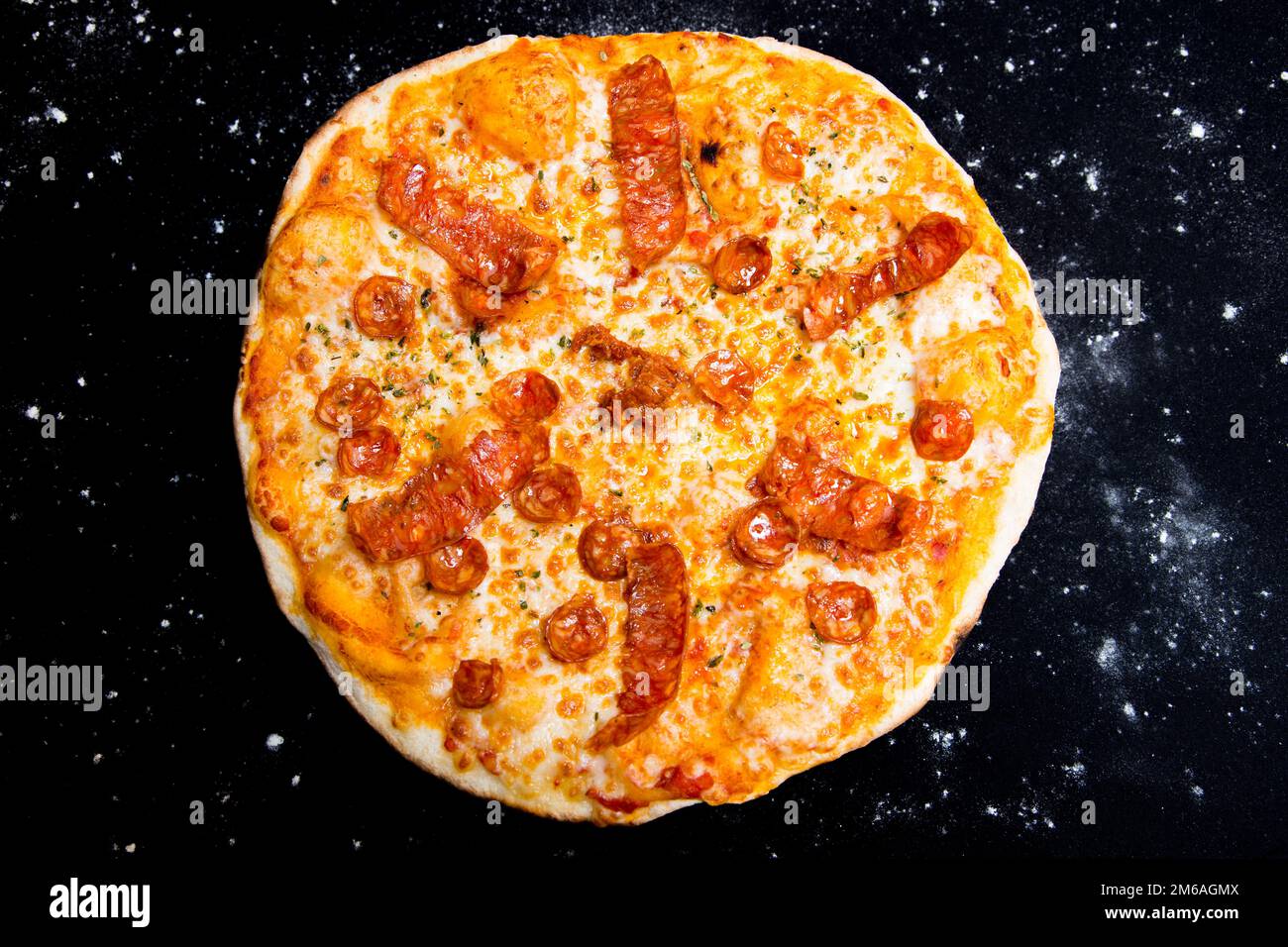 Salami Pizza. Neapolitan pizza made with salami, cheese and baked