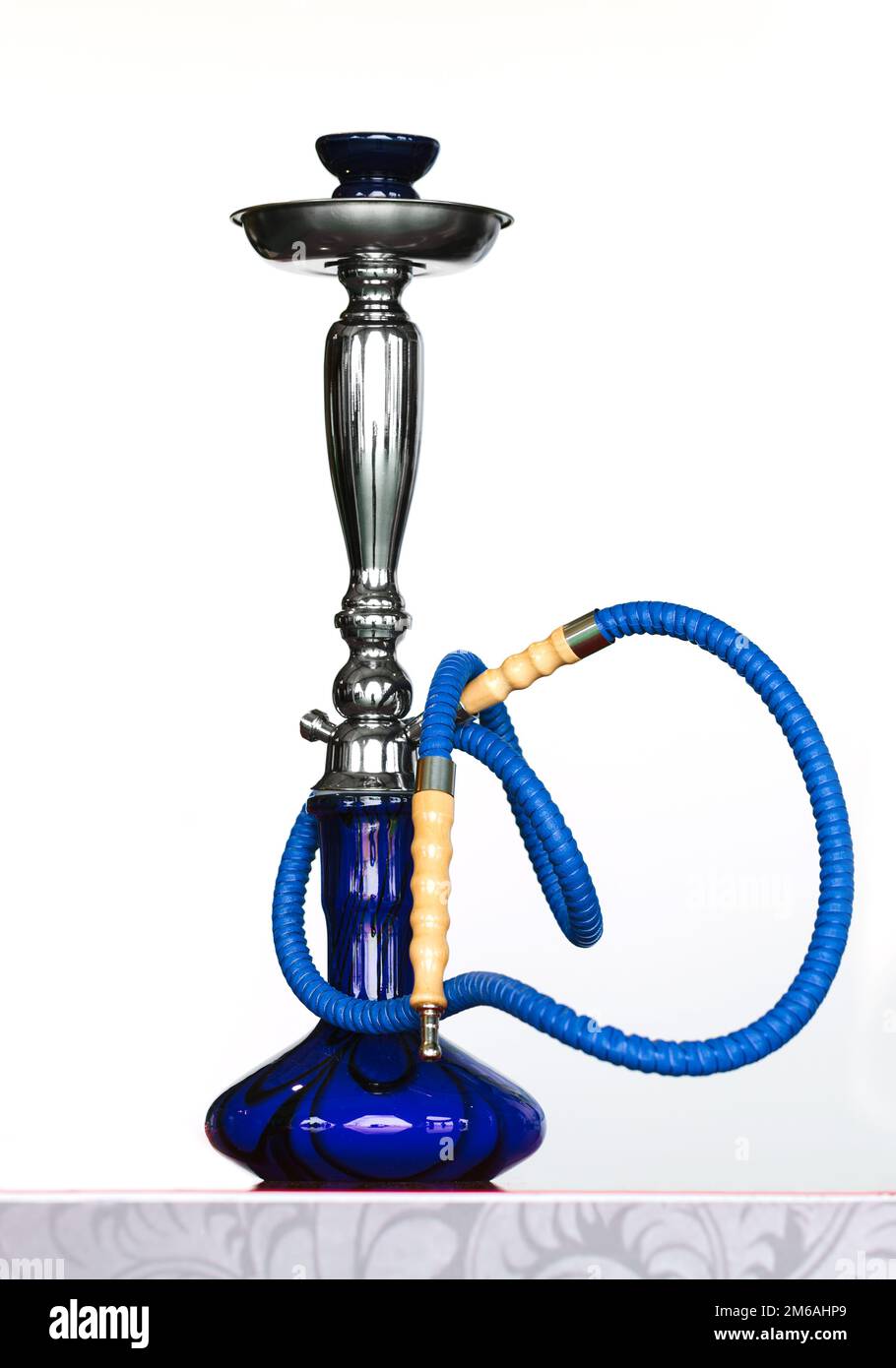 Glass pipe or bong for marijuana smoking on a blue fabric background Stock  Photo - Alamy
