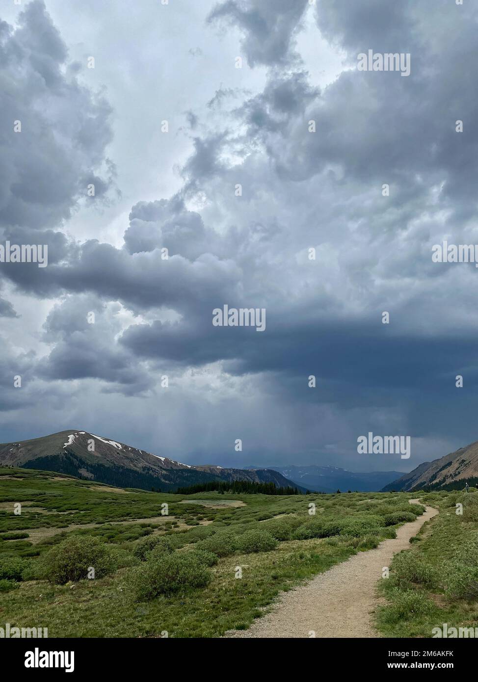 Stormy skies over hiking trail. Stock Photo