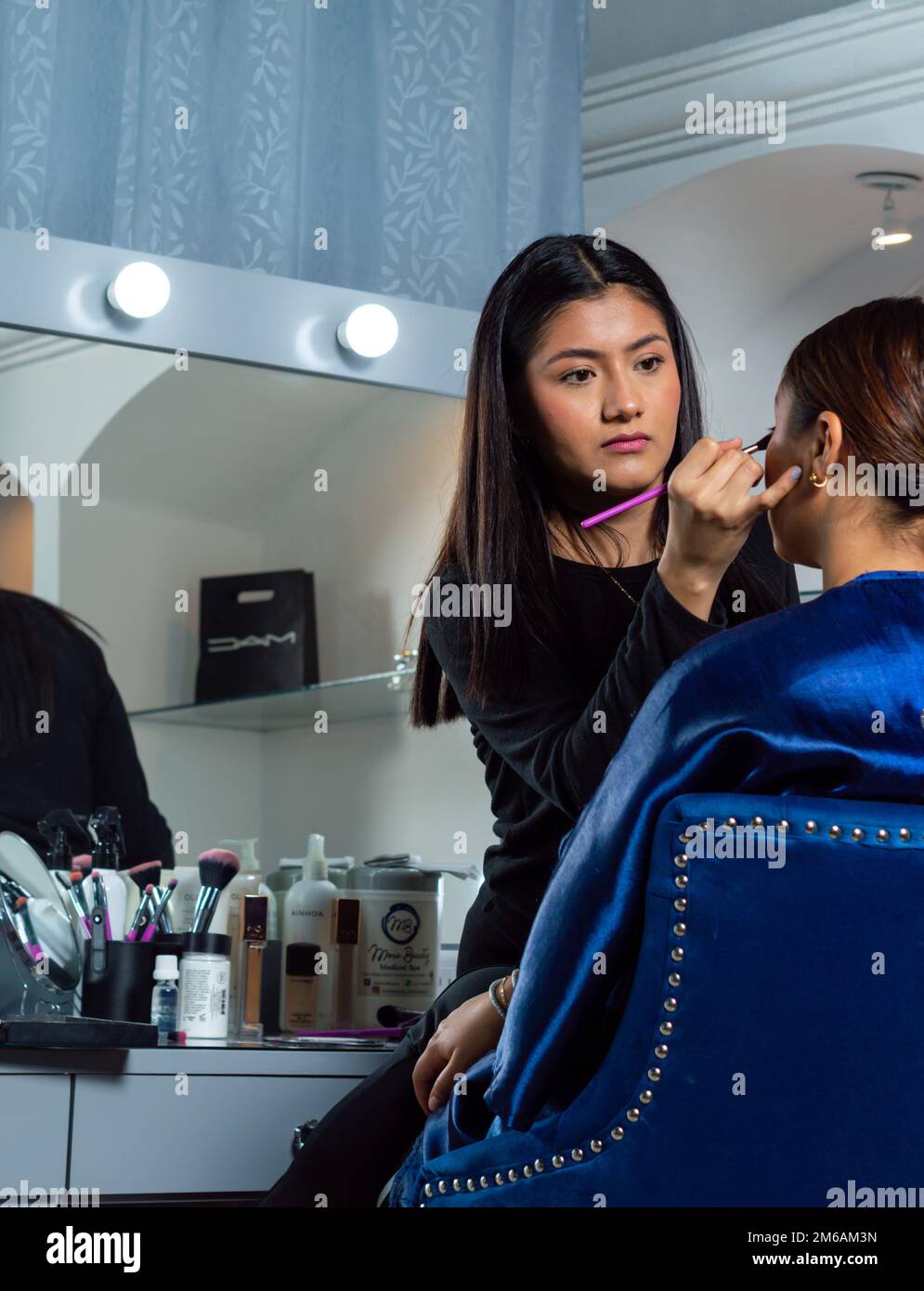 Makeup in small beauty salon Stock Photo - Alamy