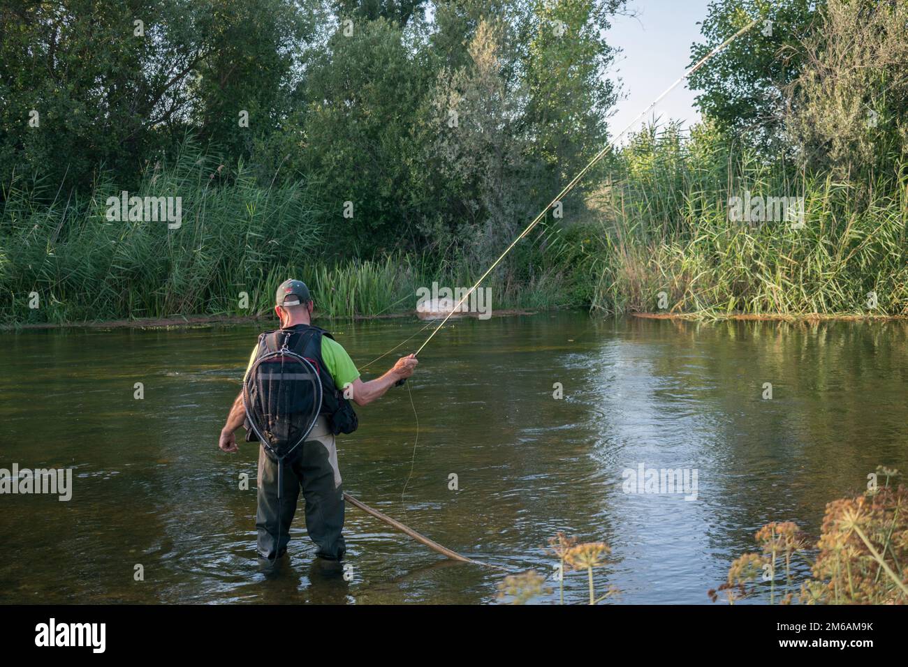 A man fishing in the river Stock Photo