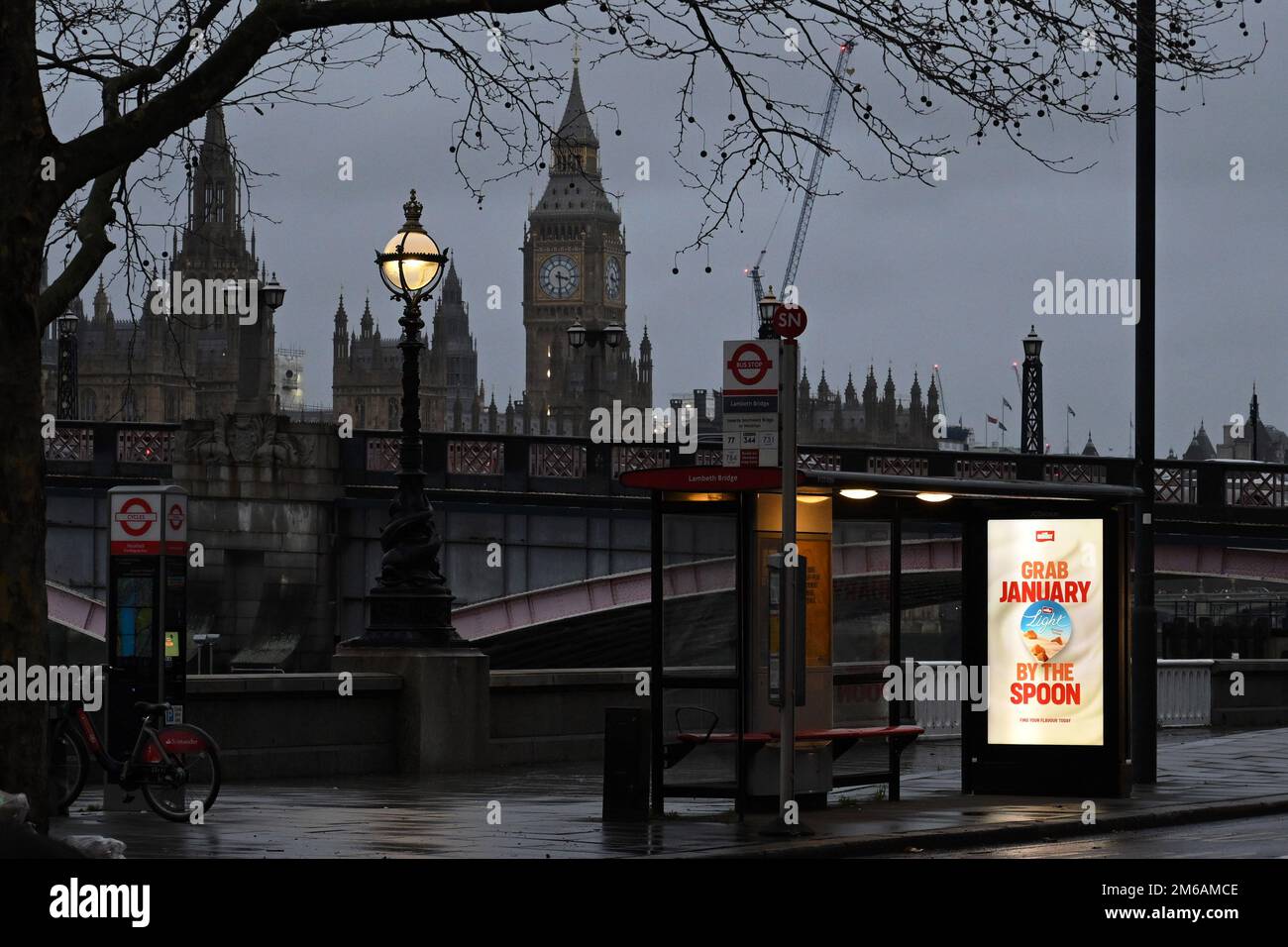 TFL Bus Stop Near Houses Of Parliament And Big Ben In The Background tfl-bus-stop-near-houses-of-parliament-and-big-ben-in-the-background