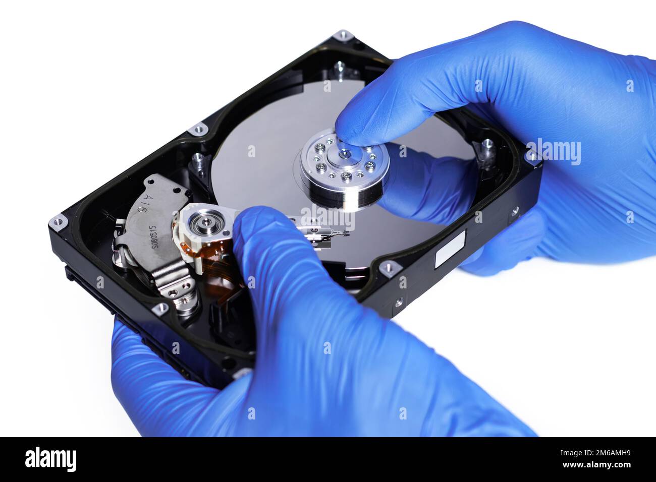 Repair Hard disk. Hands of master in gloves repair the computer hard