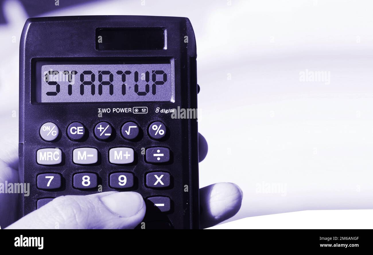 word-startup-on-calculator-display-beach-landscape-new-business
