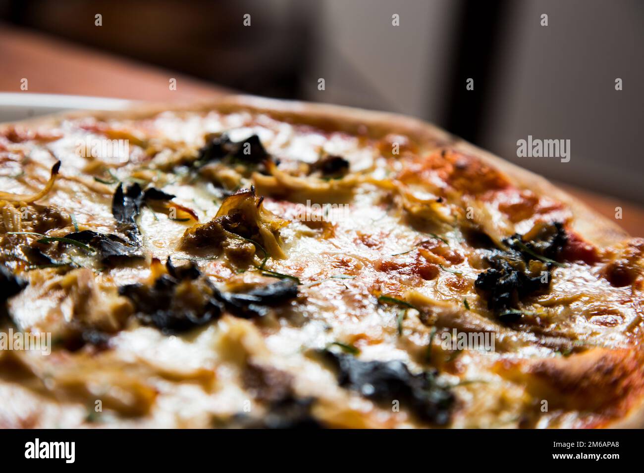 Pizza with artichokes. Neapolitan pizza made with baked vegetables
