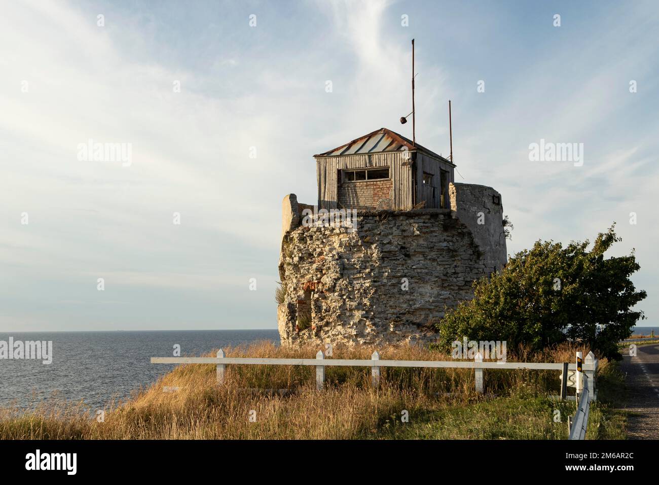 Ruin of the historic lighthouse in the evening light on the cliff on Pakri Peninsula, Harju County, Estonia Stock Photo