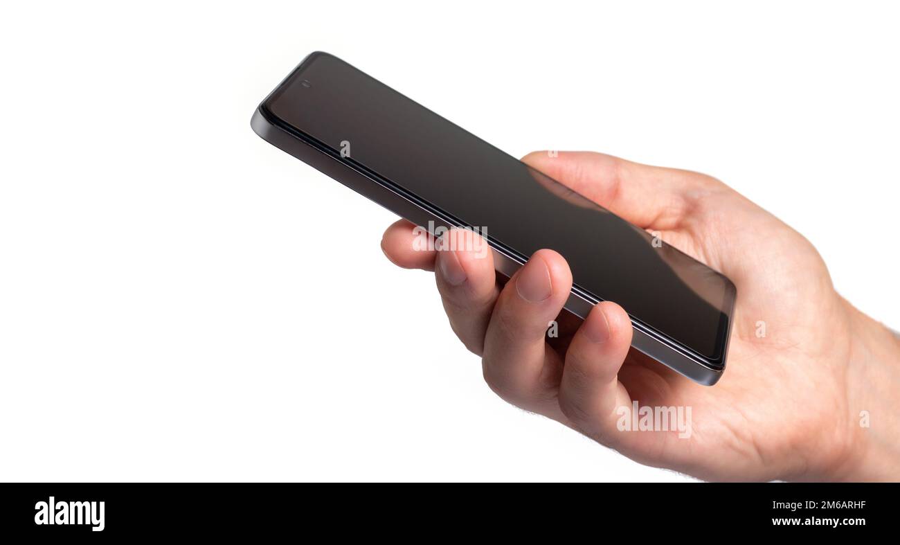 Hand holding black smartphone isolated on white background Stock Photo ...