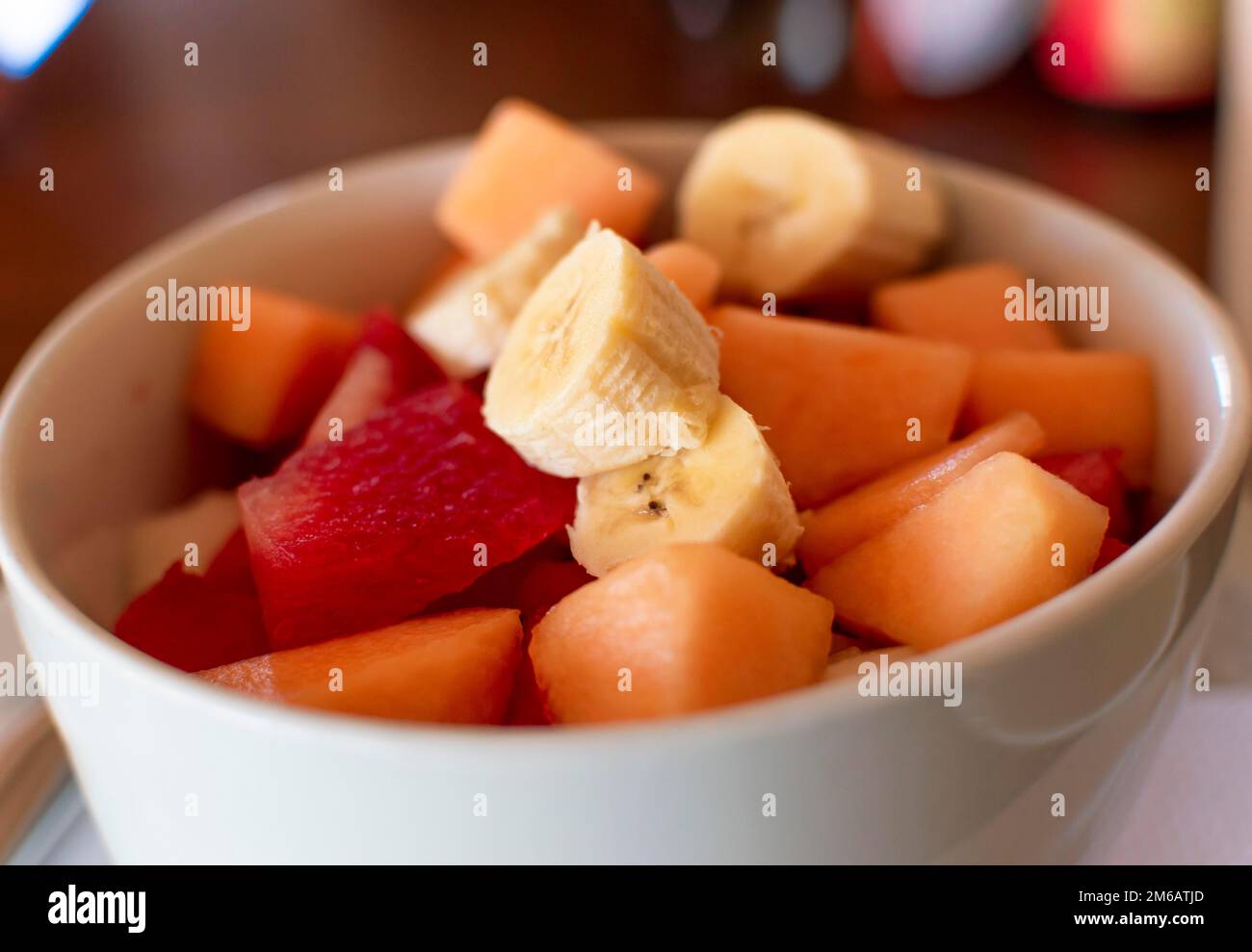 Close up of a cup of banana fruit salad with watermelon, Close up of fruit salad of banana, watermelon and melon Stock Photo