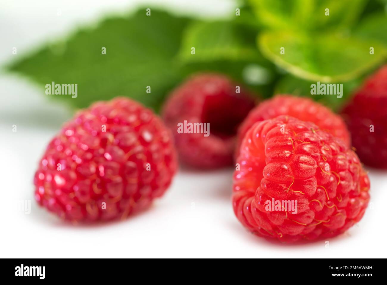 Fruit 20 Raspberry Isolated berries. Pile of raspberry fruits with leaves isolated on ...