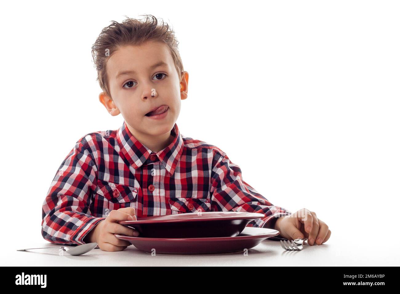 Boy licking mouth befor food Stock Photo