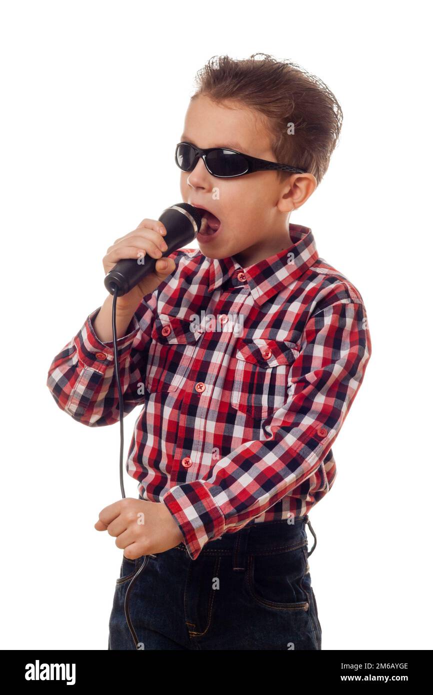 Boy in sunglasses singing Stock Photo Alamy