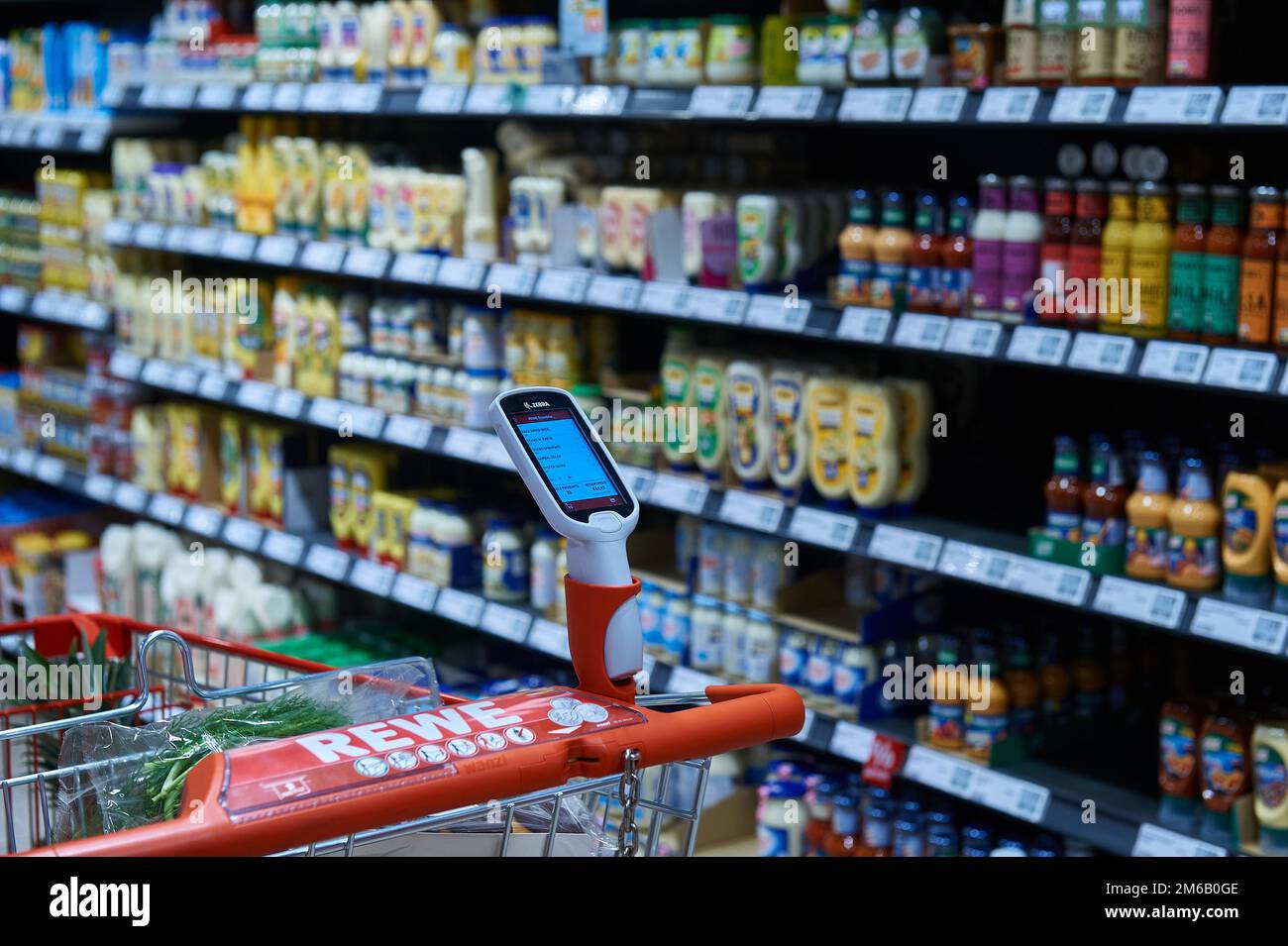 Scan and Go device for self-scanning in the holder on the shopping trolley, Rewe Center Tonndorfer main street 71-81, 22045 Hamburg, Germany Stock Photo