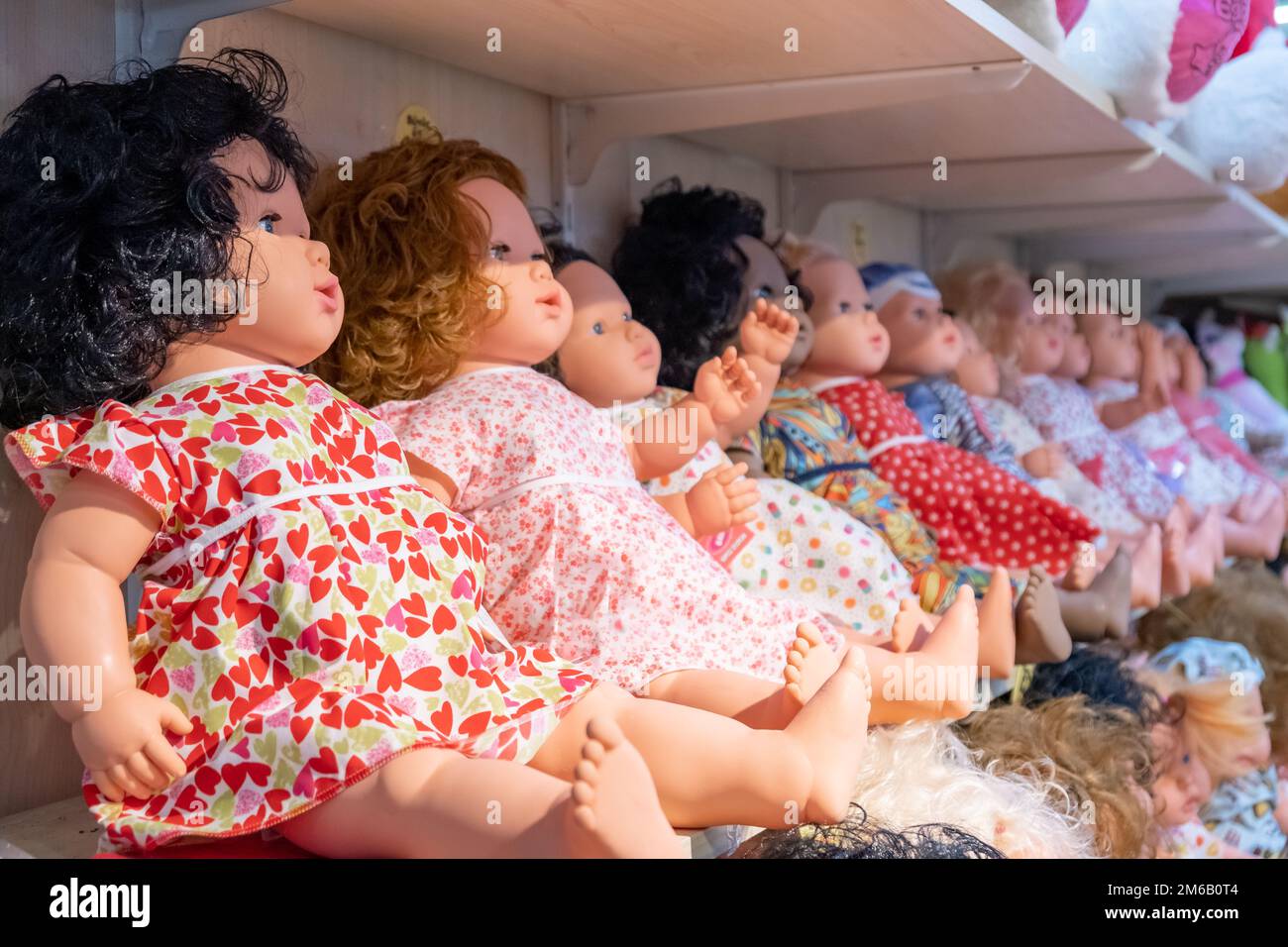 Children's store showcase with large dolls , toy store for children Stock Photo Alamy