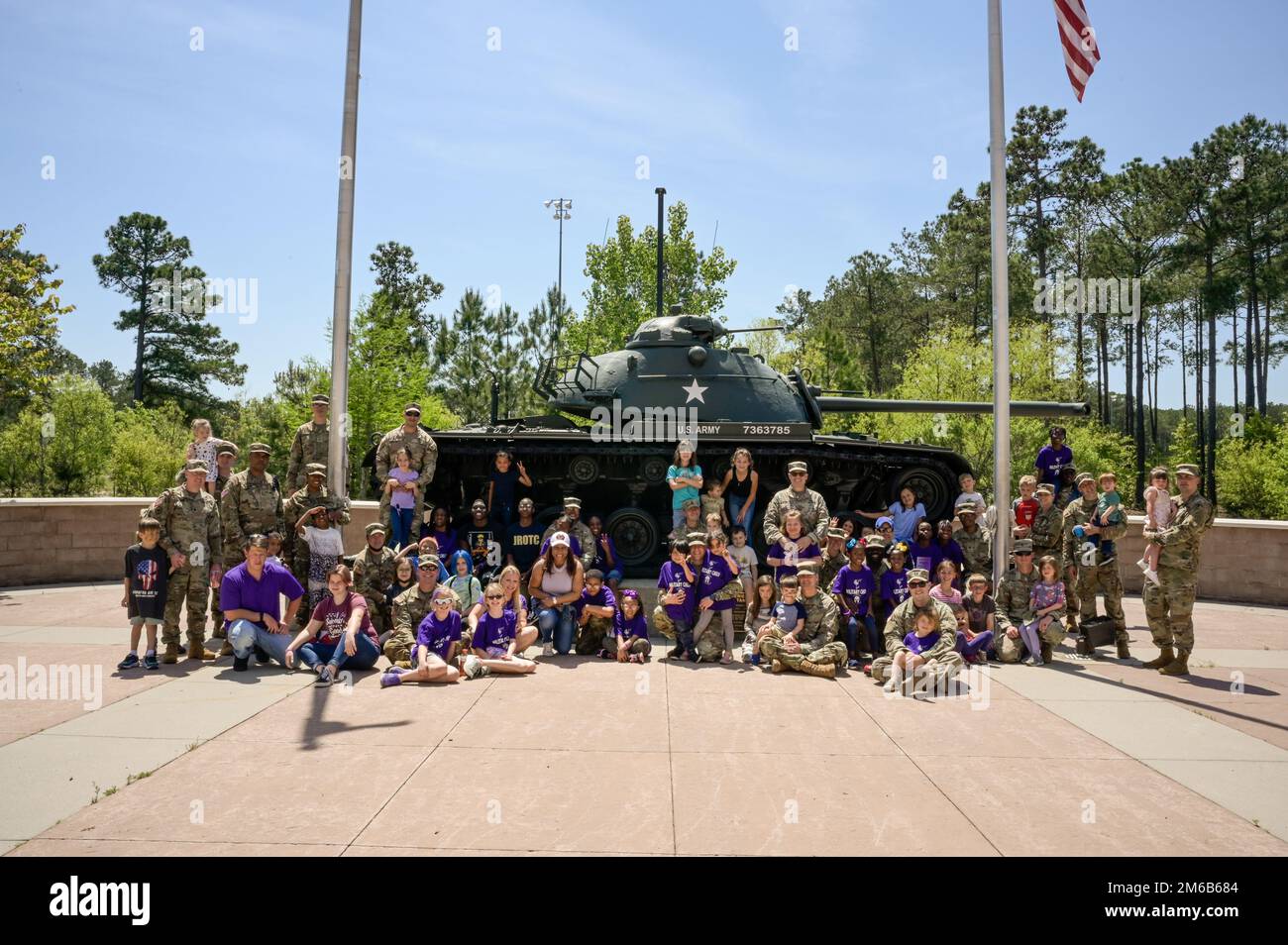 U.S. Army Central Soldiers and their families pose for a photo to conclude the events of Bring Your Child to Work Day, at USARCENT headquarters, Shaw Air Force Base, S.C., April 22, 2022. Children partook in a series of events, including games, a Military K-9 demonstration, a tour of 20th Fighter Wing flight line, and an air show as part of Bring Your Child to Work Day. Stock Photo