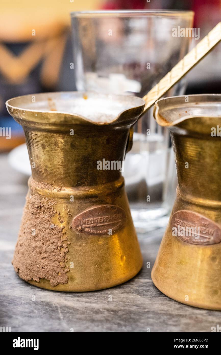 Traditional Greek Coffee, Ellinikos Kafes, Athens, Greece. Shown here is a  briki, the pot used to brew the coffee on hot sand Stock Photo - Alamy