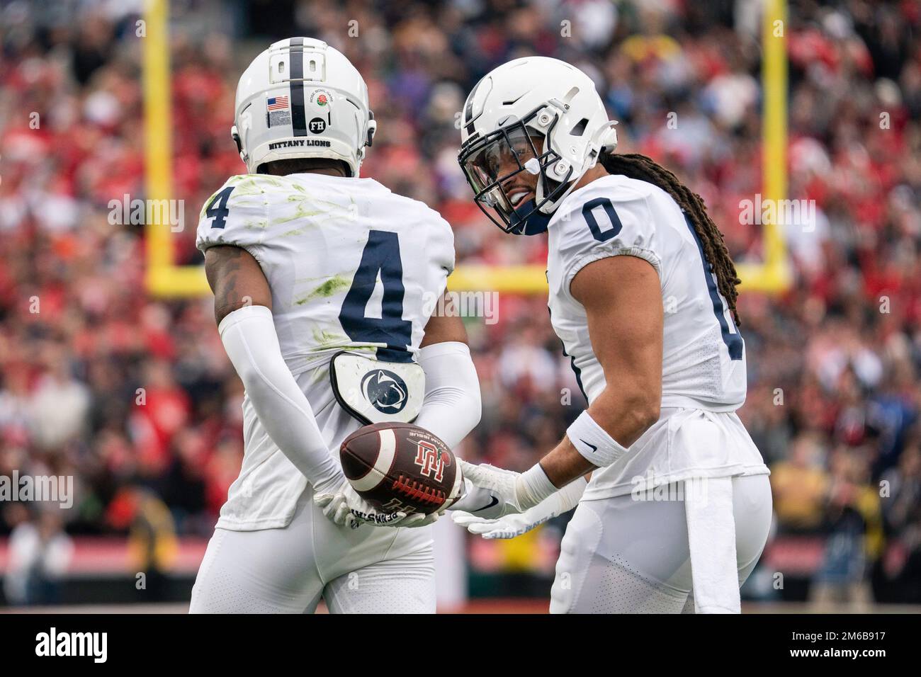 Penn State Nittany Lions linebacker Jonathan Sutherland (0) congratulates cornerback Kalen King (4) after he made an interception during the 109th Ros Stock Photo