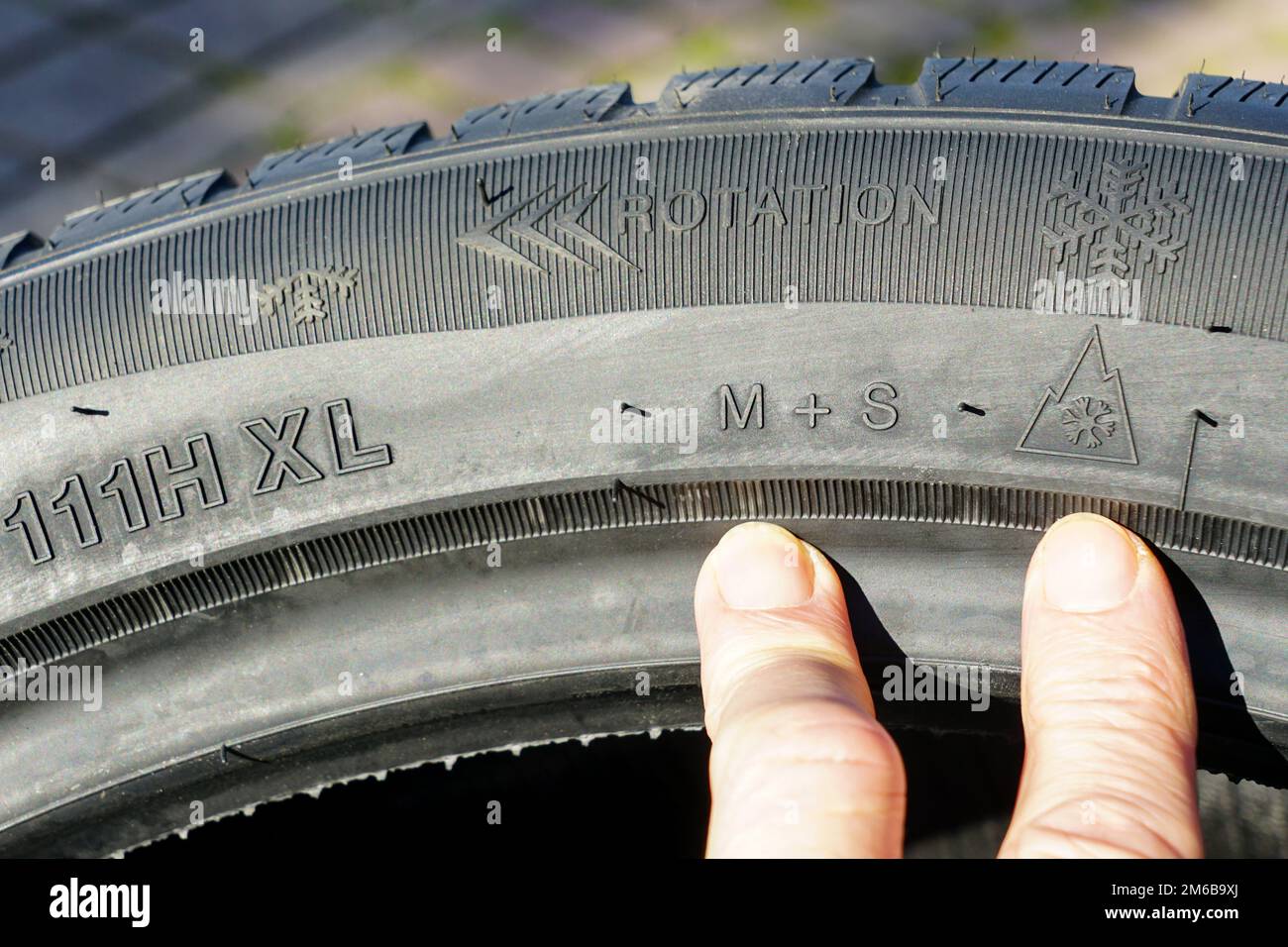 Markings on the sidewall of a new winter tire, markings for speed, load