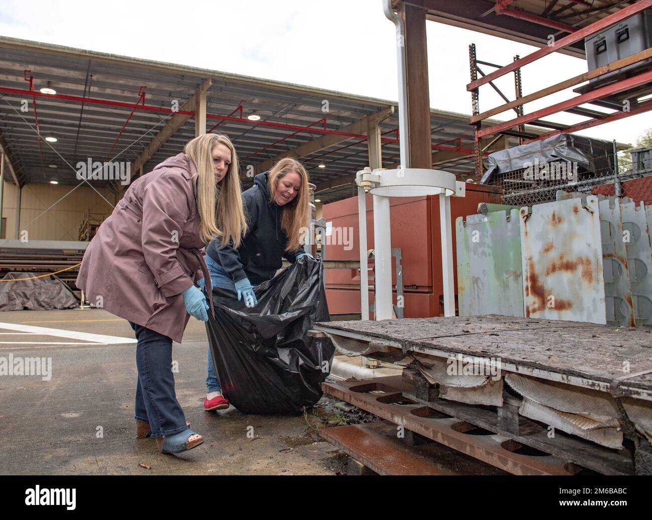 SILVERDALE, Wash. (April 22, 2022) – Glenda Sippel (left), a program analyst at Trident Refit Facility, Bangor (TRFB), and Kimberly Perdue, a resource manager at TRFB, participate in a cleanup at TRFB in celebration of Earth Day 2022. The Earth Day 2022 cleanup was hosted as an effort to help protect the environment and foster stewardship in the local area. TRFB supports the nation’s strategic deterrence mission by repairing, incrementally overhauling, and modernizing Pacific Fleet strategic ballistic missile submarines during refits. Stock Photo
