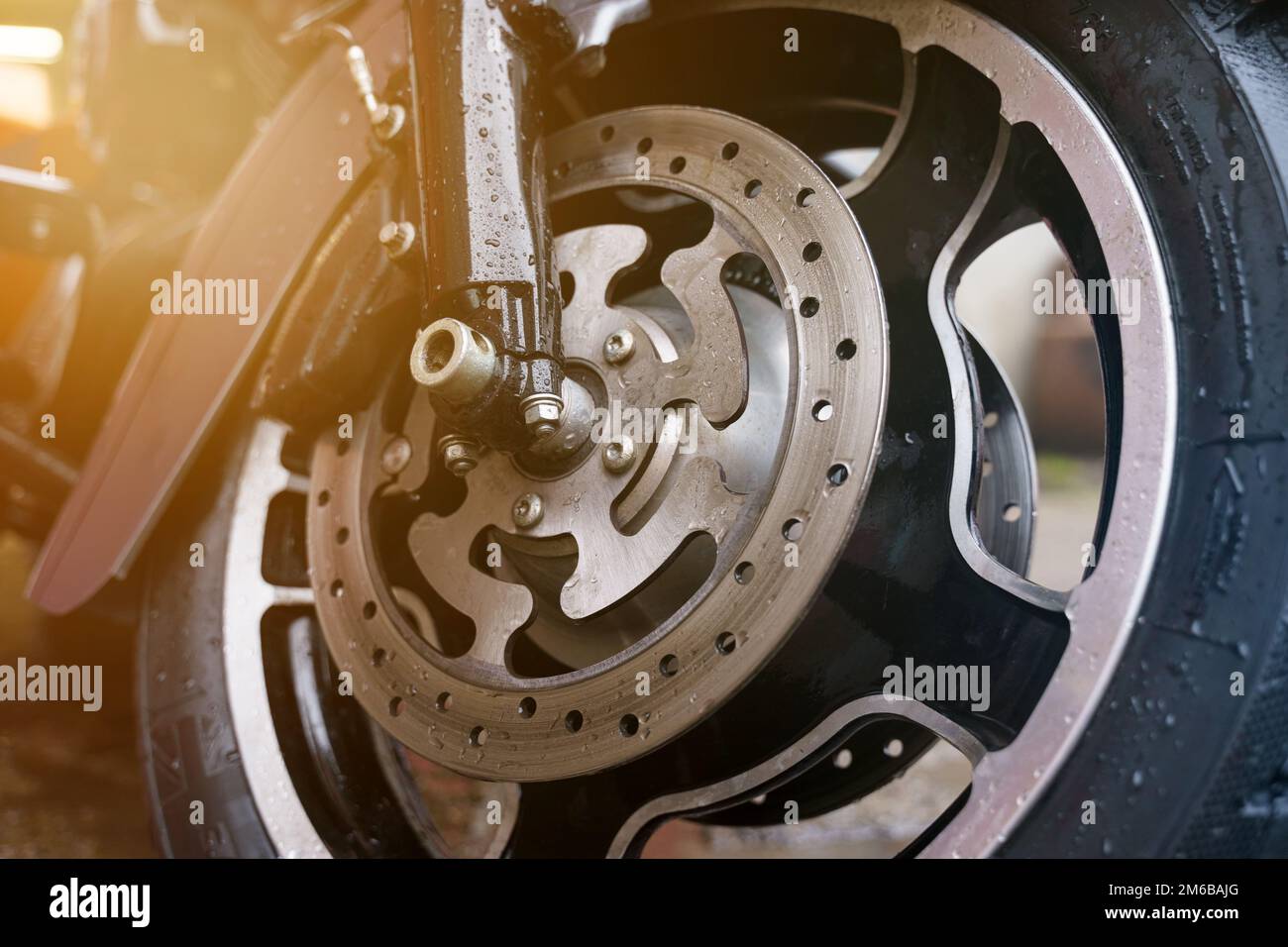 Wheel and disc brake system of a motorcycle closeup. Transport concept