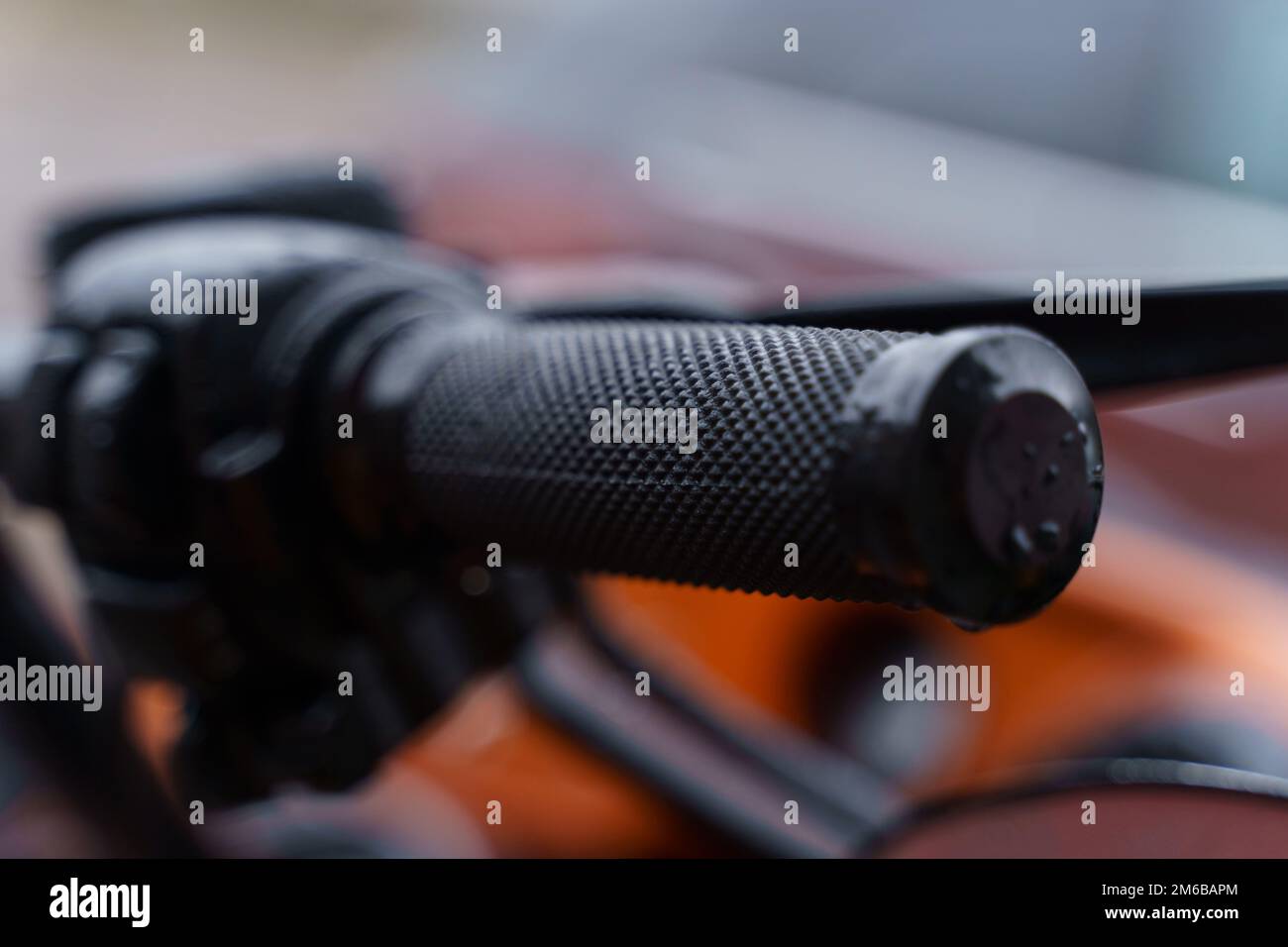 Black throttle on a motorcycle handlebar. Close-up. Transport concept. Stock Photo