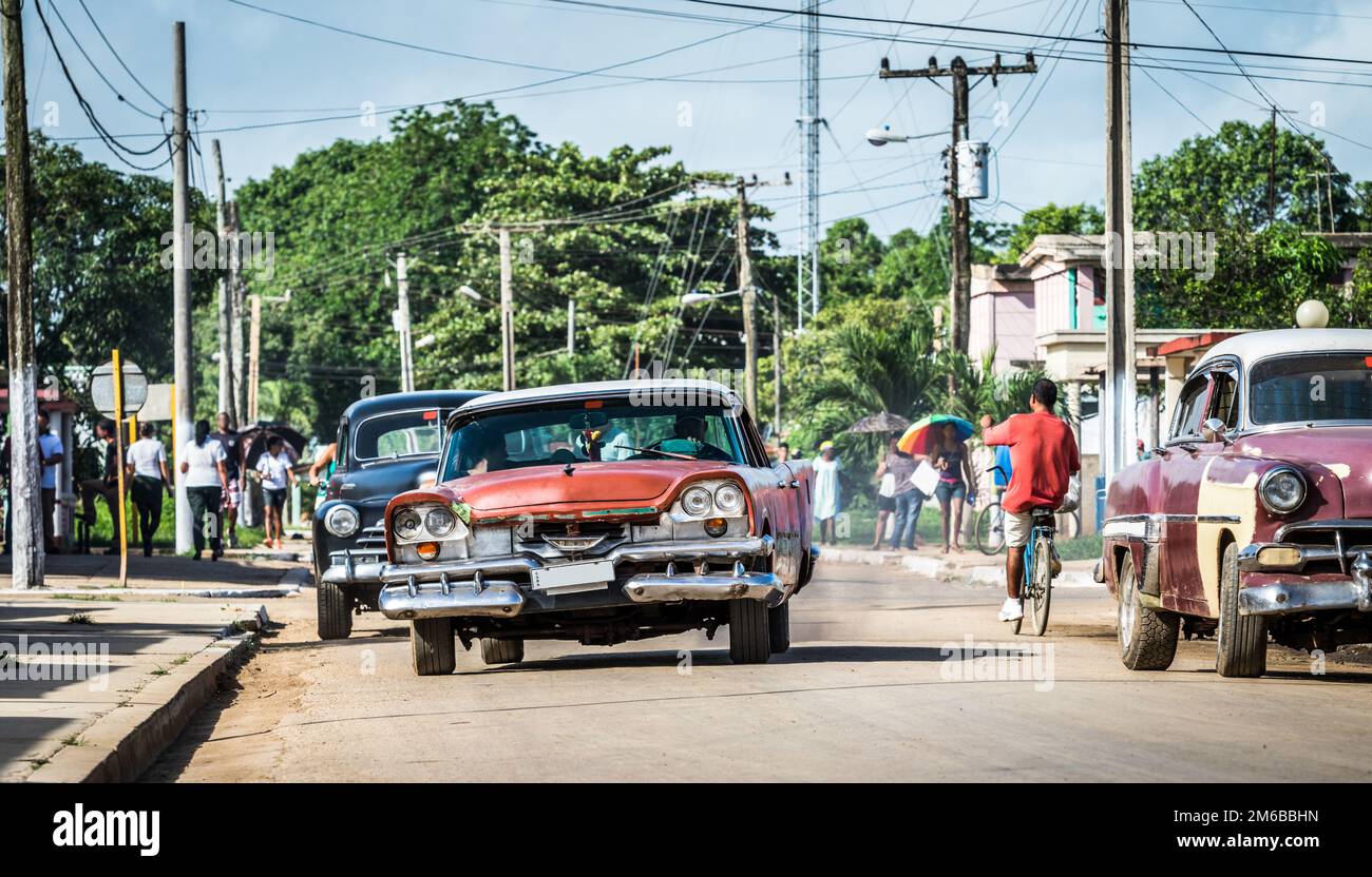 Street life in Santa Clara Cuba with american classic cars Stock Photo
