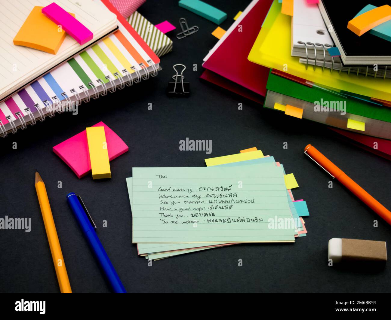 Learning New Language Writing Words Many Times on the Notebook; Thai Stock Photo