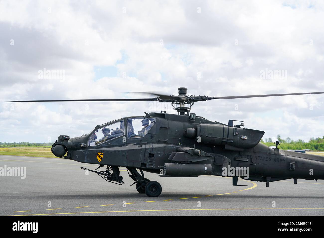 Liepaja, Latvia - August 07, 2022: AH-64D Apache attack helicopter from United States army with crew after landing at the airport runway Stock Photo
