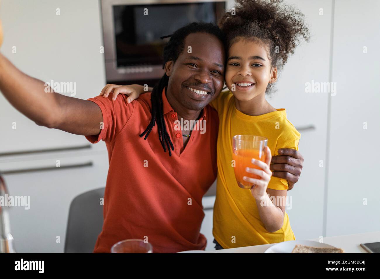 Happy Black Father And Daughter Taking Selfie In Kitchen While Having ...