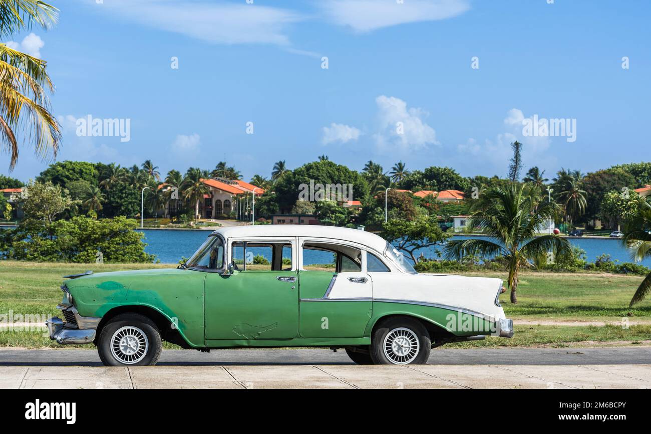 Green american Oldtimer with white roof in Cuba Varadero Stock Photo