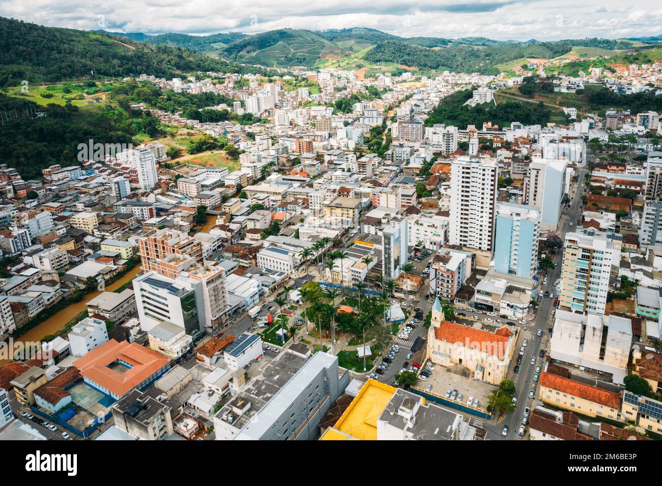 Vew of main square with St. Lawrence Church in Manhuacu, Minas Gerais, Brazil with surrounding cityscape Stock Photo