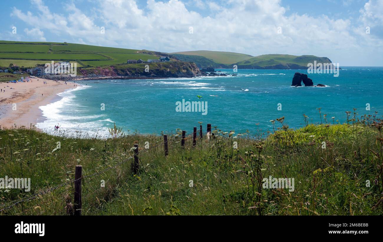 Walks explore the coast at Thurlestone sea, Devon, UK Stock Photo Alamy