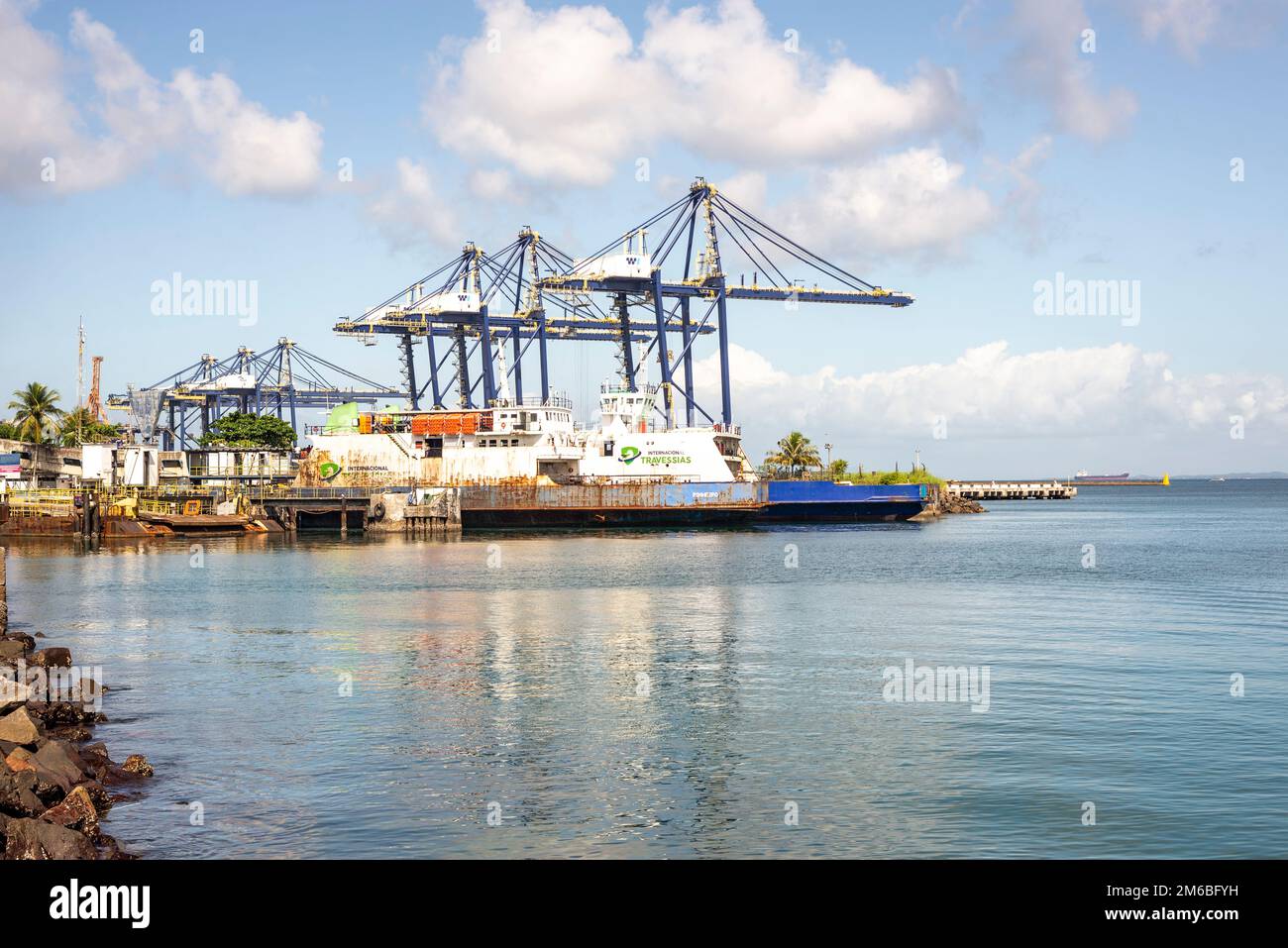 Salvador, Bahia, Brazil - May 06, 2022: Panorama of the commercial maritime port of Salvador, Brazil. Cargo containers, industrial cranes and shipyard Stock Photo