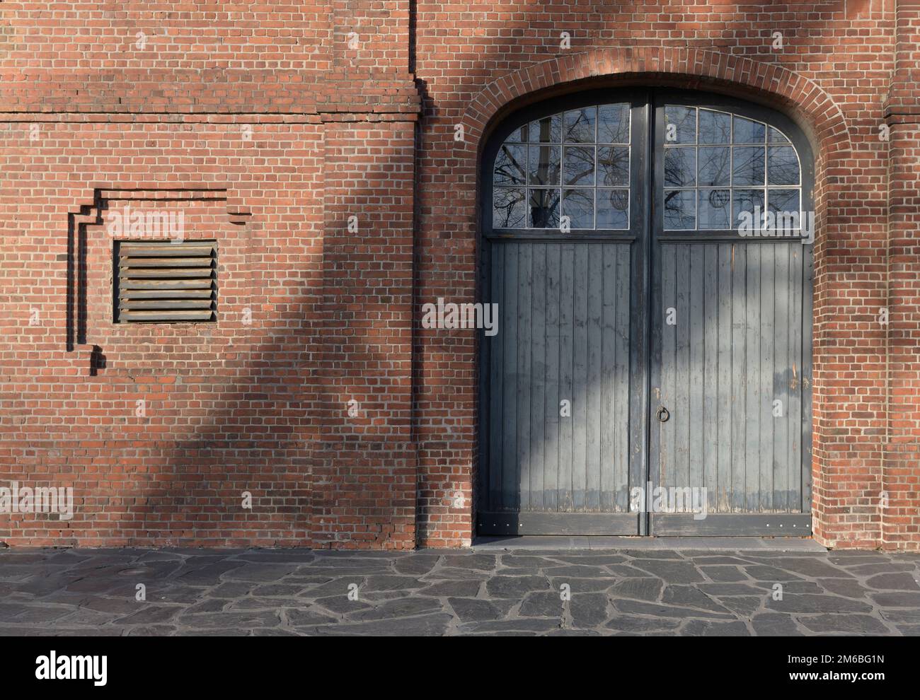 architecture of the last century, Old gate doors, brick wall. Europe