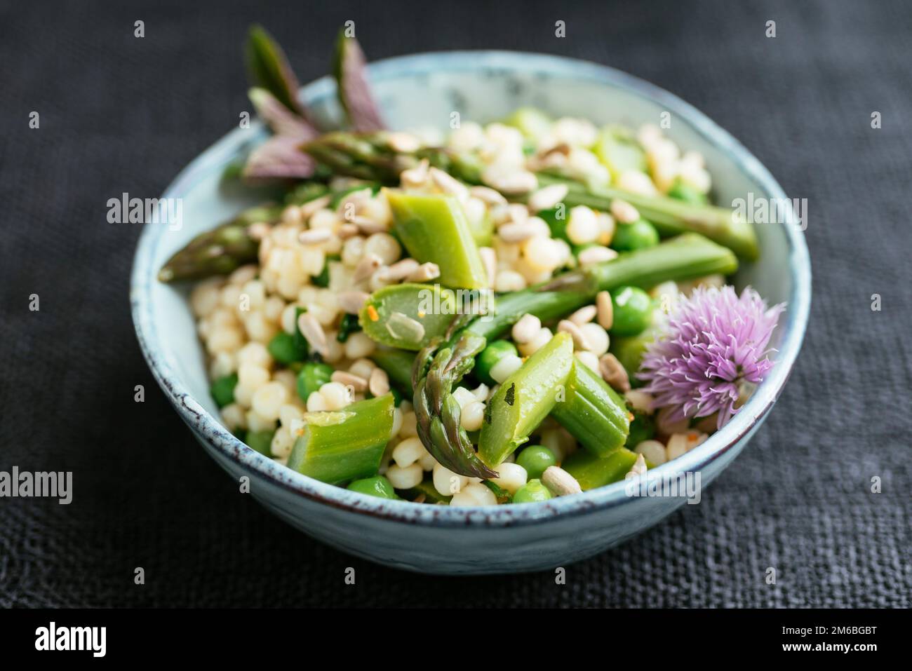 Spring Salad with Asparagus, Peas and Pearl Couscous Stock Photo