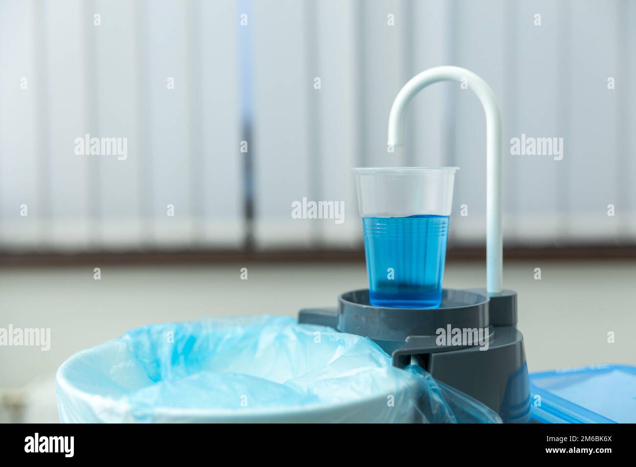 Dentist cup or glass water for wash mouth and sink. Sink Scaling tool