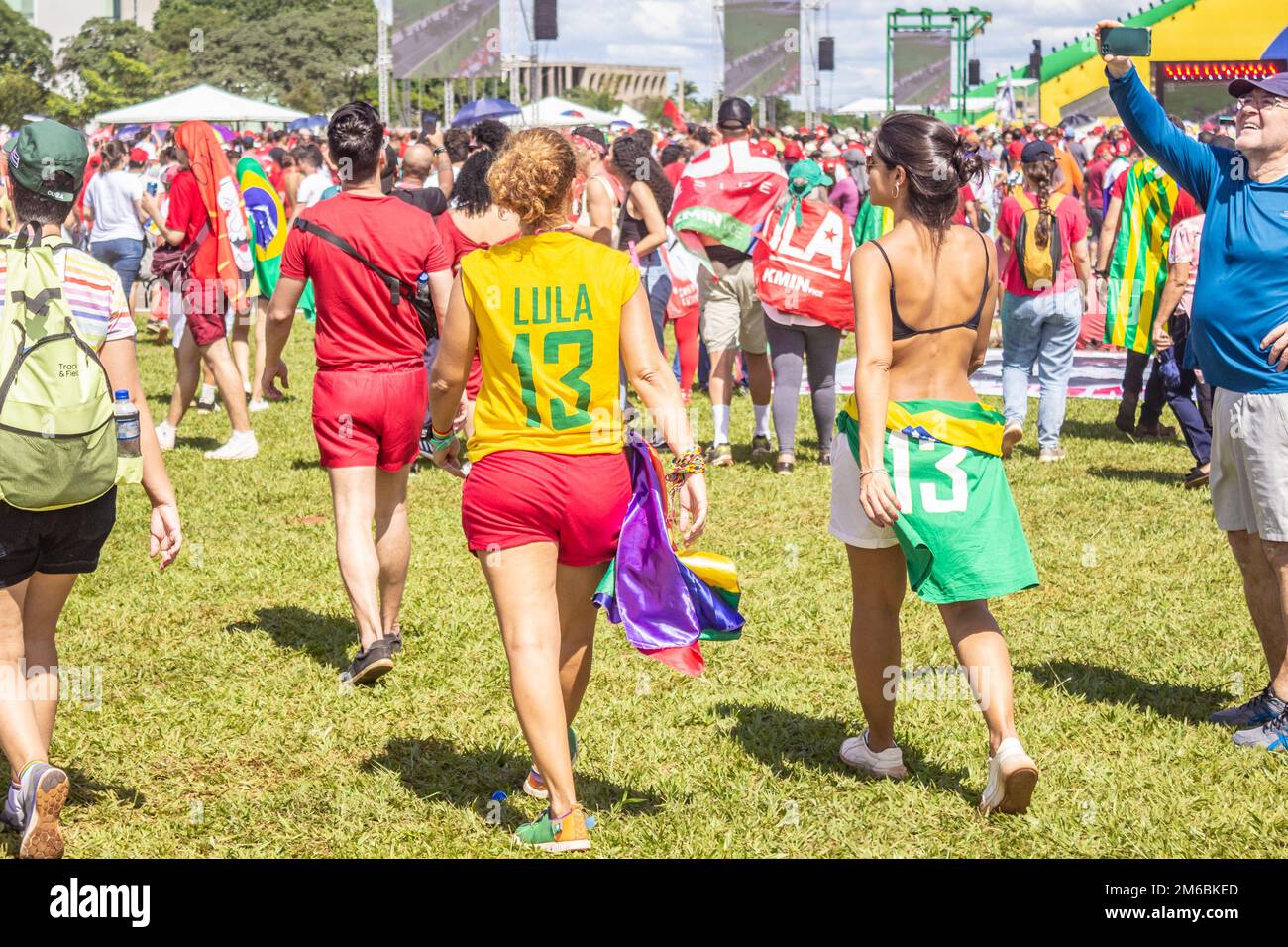 Brasília, DF, Brazil – January 01, 2023: Two women walking in shirts with the number 13 on them. Photo taken at the inauguration event. Stock Photo