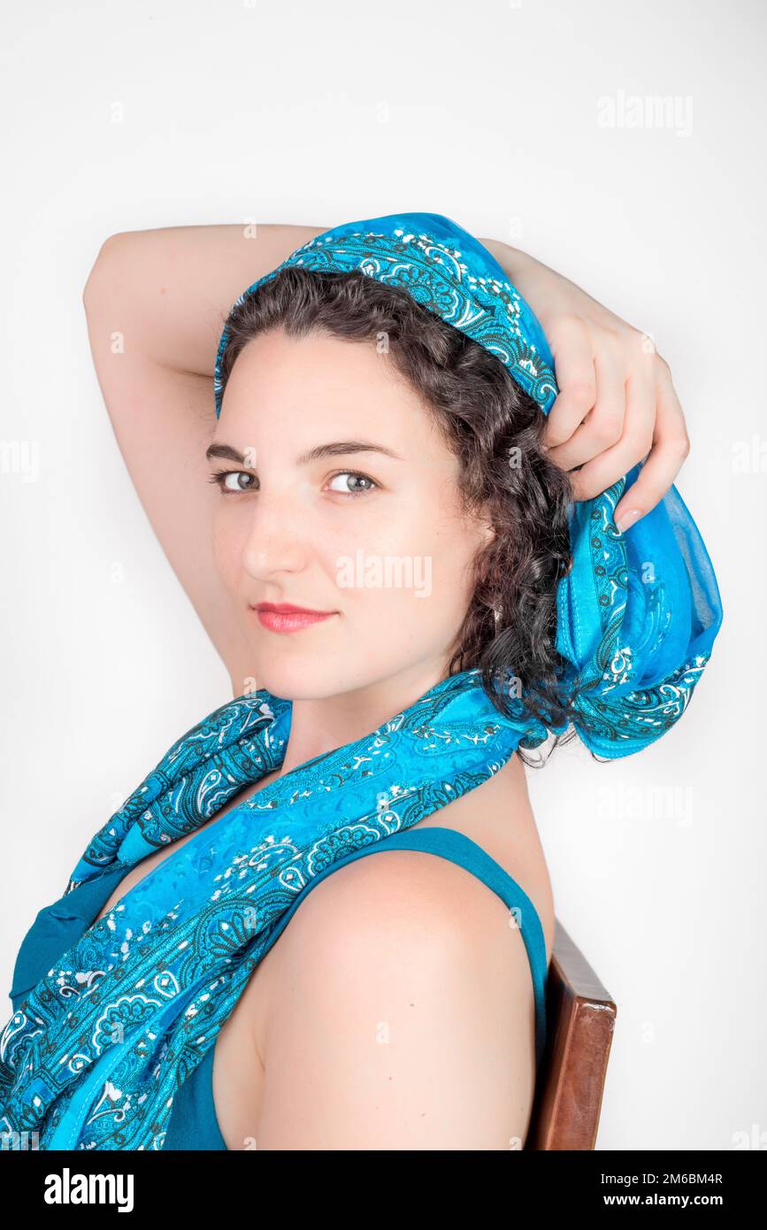 Portrait of a young woman with black hair and light blue dress Stock ...