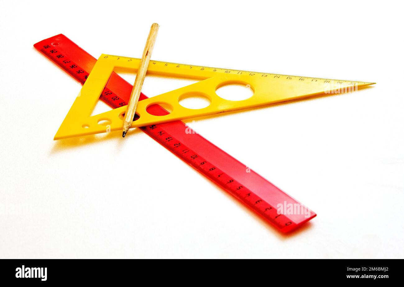 Drawing Accessories (triangle, ruler and pencil) on a white background