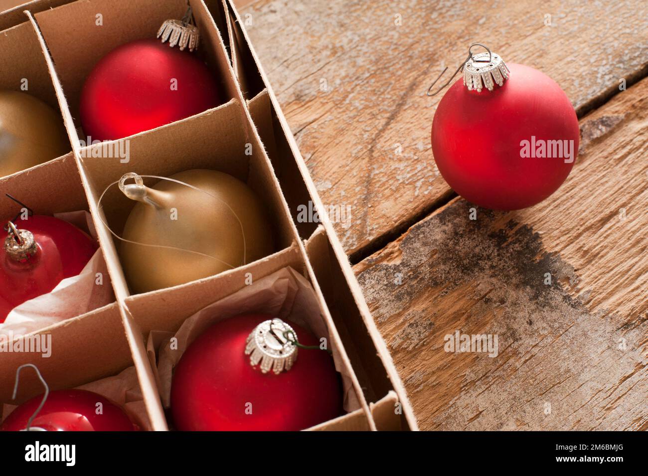 Red and gold Christmas baubles in a box Stock Photo
