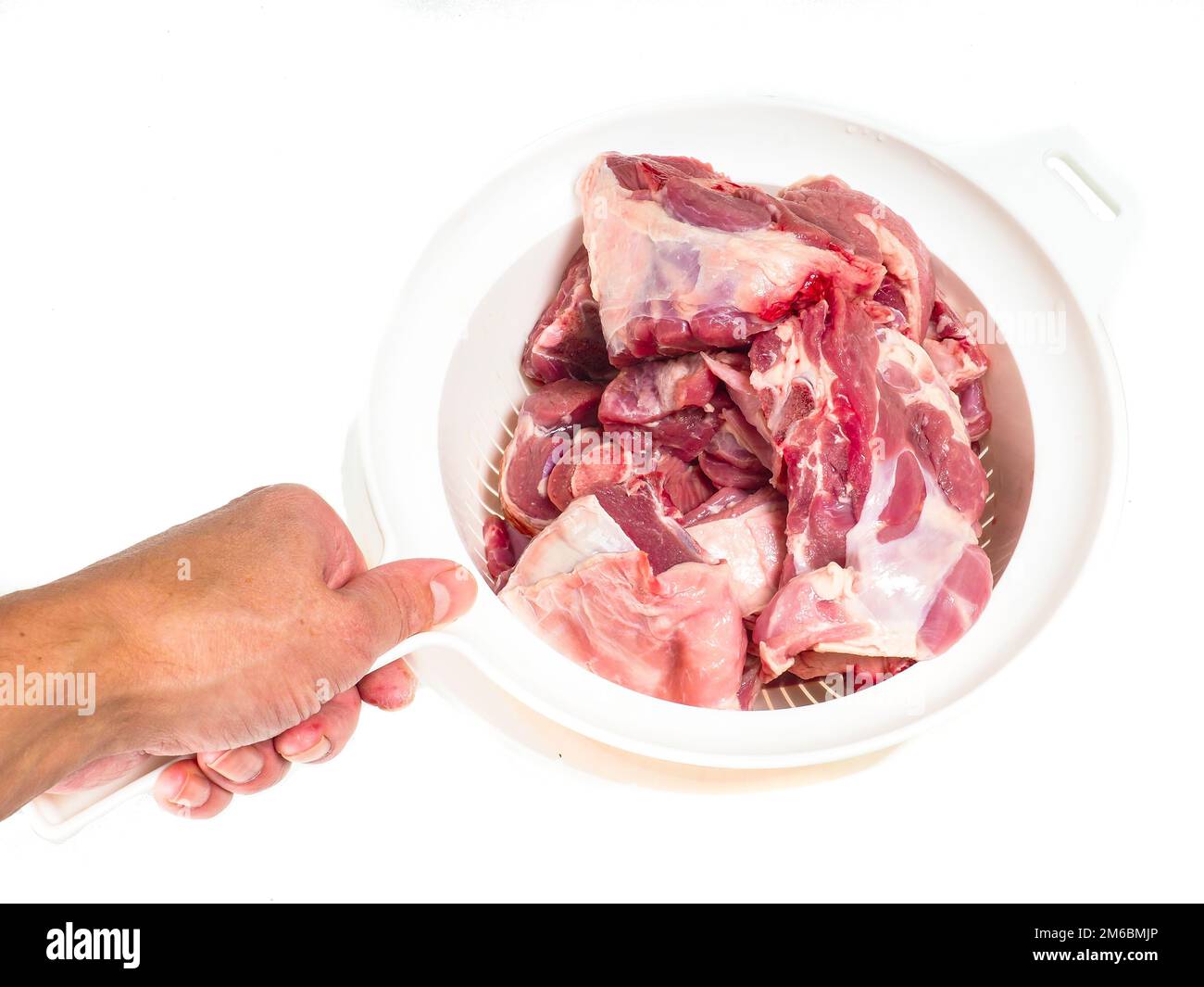 Fresh red lamb meat in a colander Stock Photo