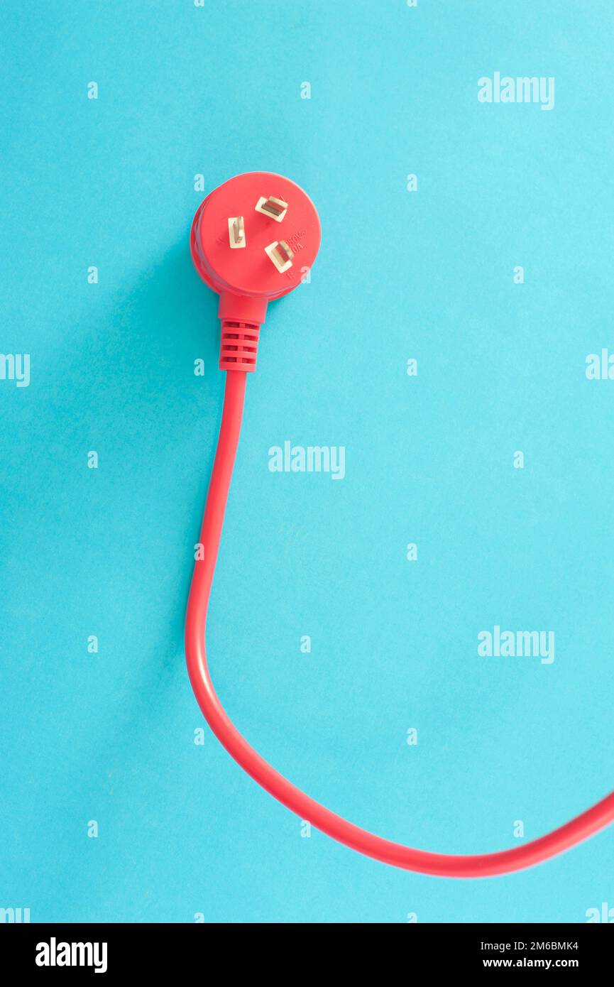 Red electrical lead with integrated plug Stock Photo Alamy