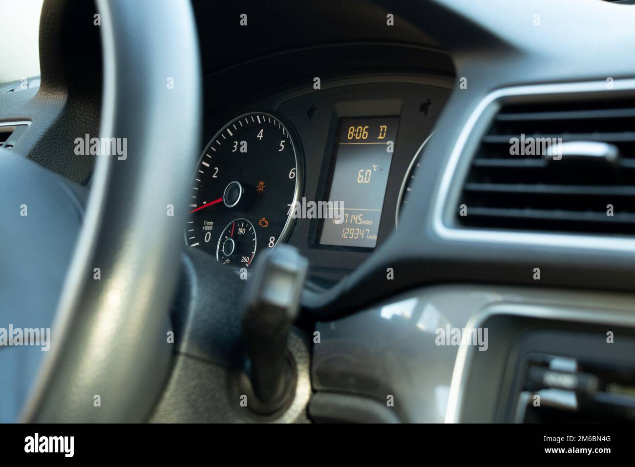 speedometer and steering wheel in auto close-up Stock Photo - Alamy