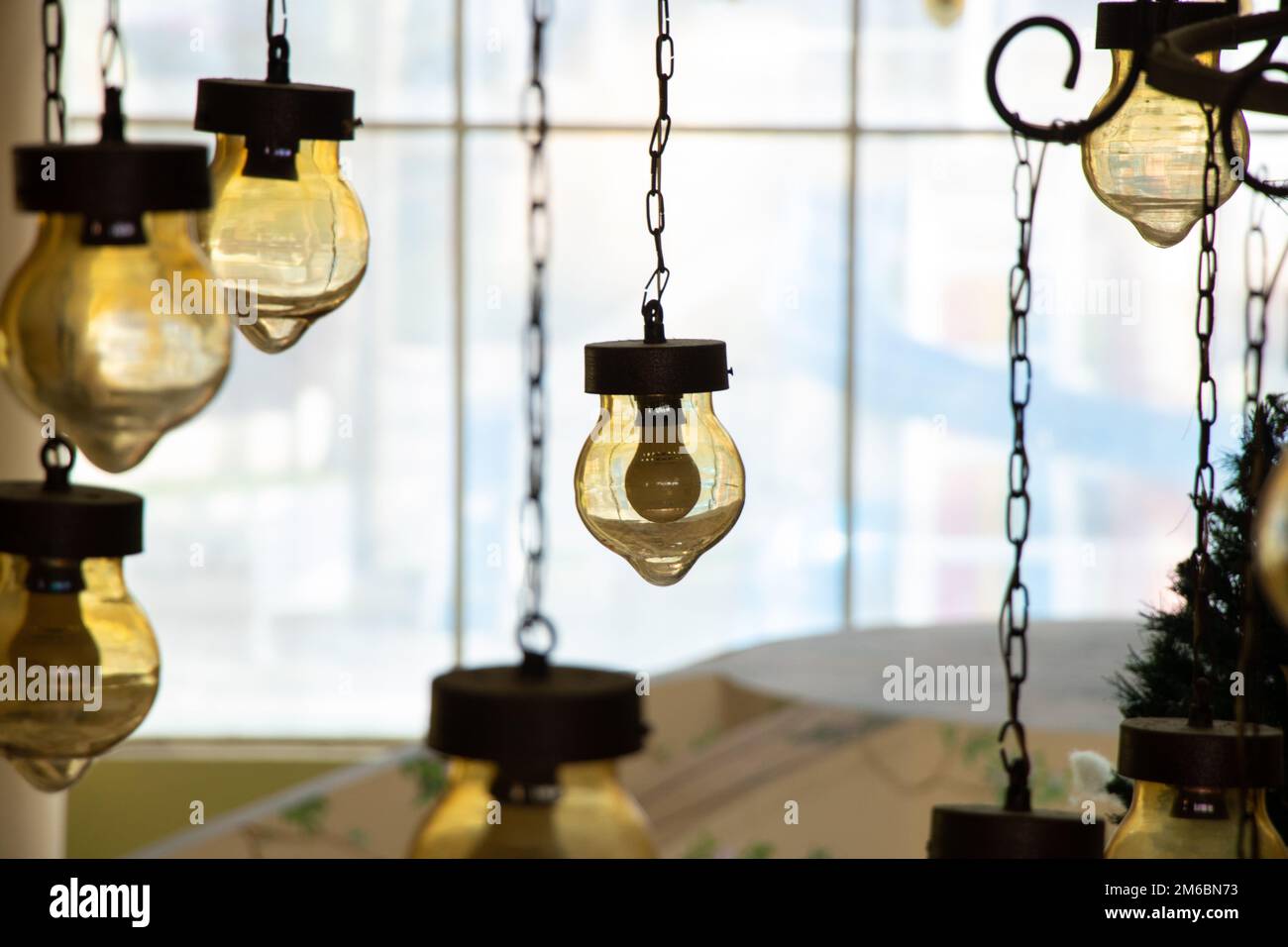 old vintage chandelier hanging on the ceiling of a hotel in egypt close-up Stock Photo