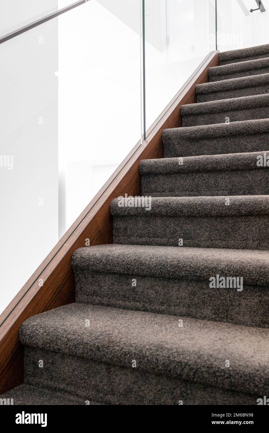 grey carpeted staircase Stock Photo