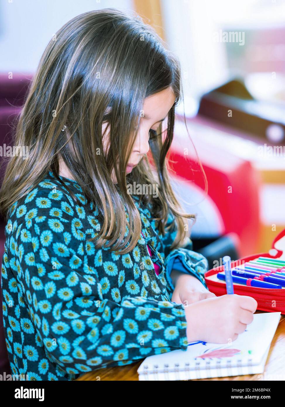 Portrait of lovely girl drawing with colorful pencils Stock Photo - Alamy